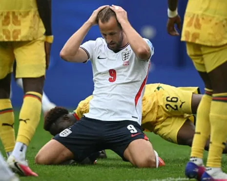Harry Kane looks disappointed on his knees.