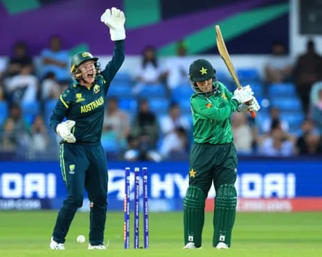Pakistan's Nashra Sandhu is bowled out by Australia's Sophie Molineux.