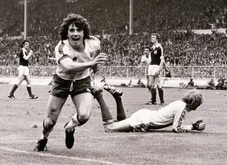 Kevin Keegan, seen here celebrating after scoring for England against Scotland in 1979, has died at the age of 75.