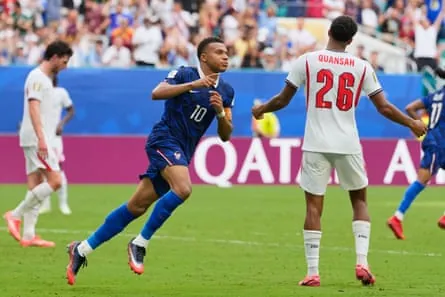 Kylian Mbappé celebrates after scoring France's third goal.