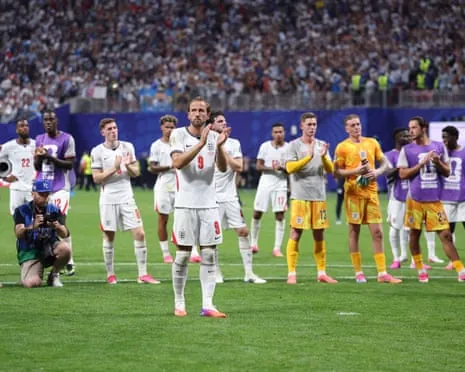 England’s players, led by Harry Kane, applaud their supporters after the full-time whistle